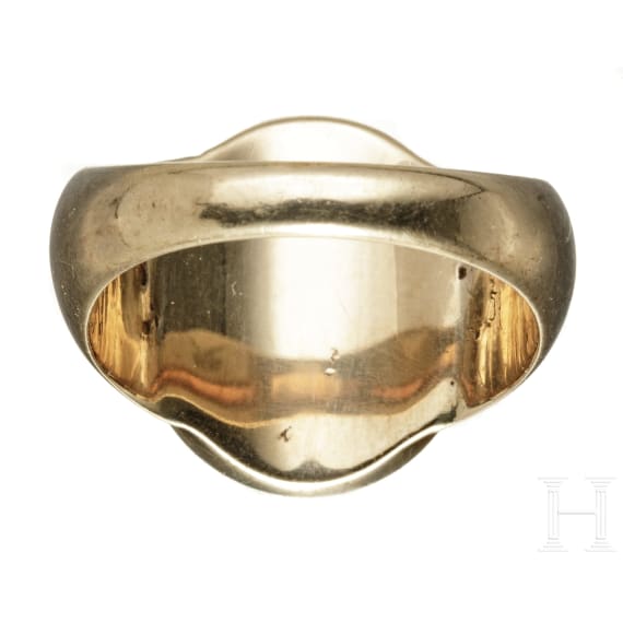 A German gold ring set with an antique intaglio stone, circa 1900