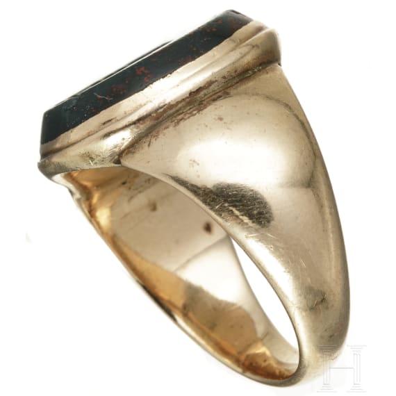 A German gold ring set with an antique intaglio stone, circa 1900