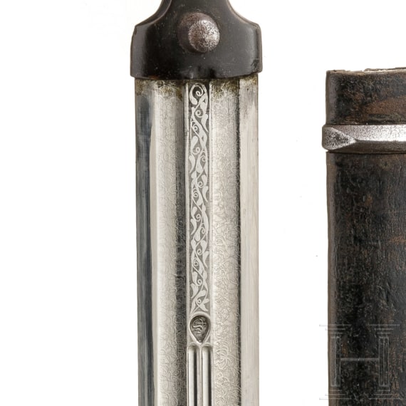 A Caucasian silver-inlaid kinjal with a folding by-knife, circa 1900