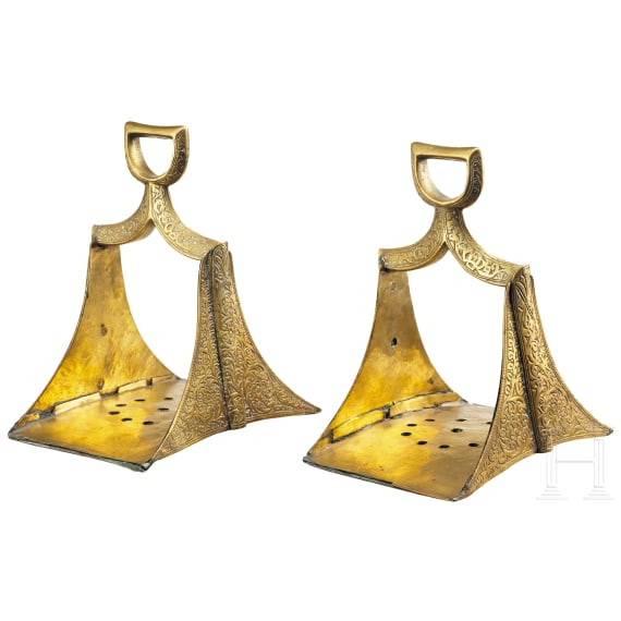 A pair of Moroccan engraved stirrups, 19th century