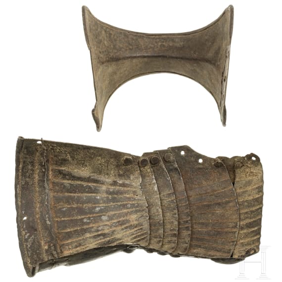 A German Maximilian gauntlet and fragment of a couter, beginning of the 16th century