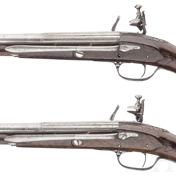 A pair of deluxe chiselled flintlock pistols, Cunet, Lyon, circa 1660