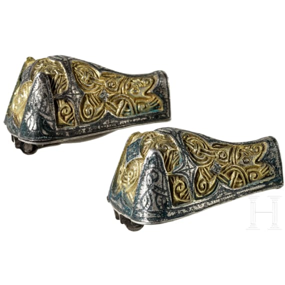A pair of Viking silver fibulae with gilding in the shape of wild boars' heads with animal-style decoration, 1st half of the 10th century