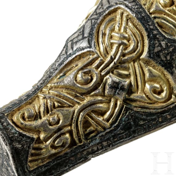 A pair of Viking silver fibulae with gilding in the shape of wild boars' heads with animal-style decoration, 1st half of the 10th century