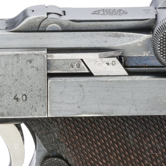 A Luger pistol by DWM, 1915, with holster