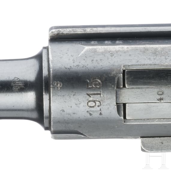 A Luger pistol by DWM, 1915, with holster