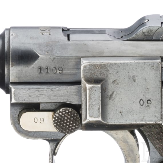 A Luger pistol by DWM, 1916, with holster