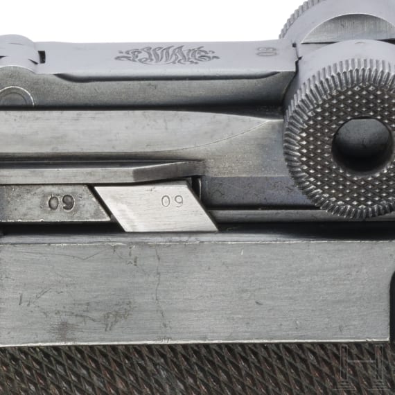 A Luger pistol by DWM, 1916, with holster