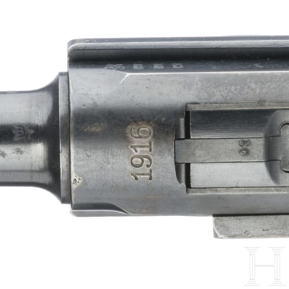 A Luger pistol by DWM, 1916, with holster