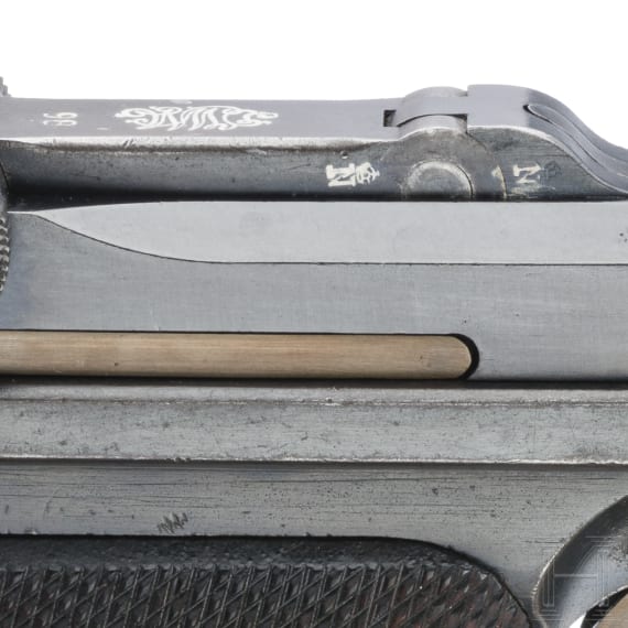 A Luger pistol by DWM, 1918, "Lazy S Death's Head"