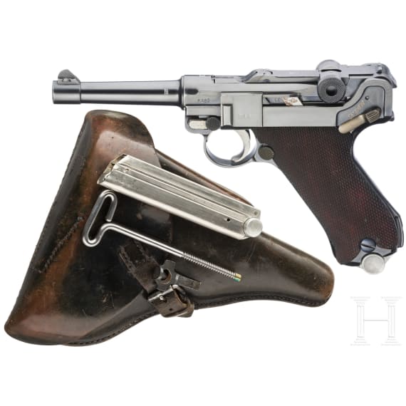 A Luger pistol by Mauser, code "K - S/42", with two matching-number mags and holster