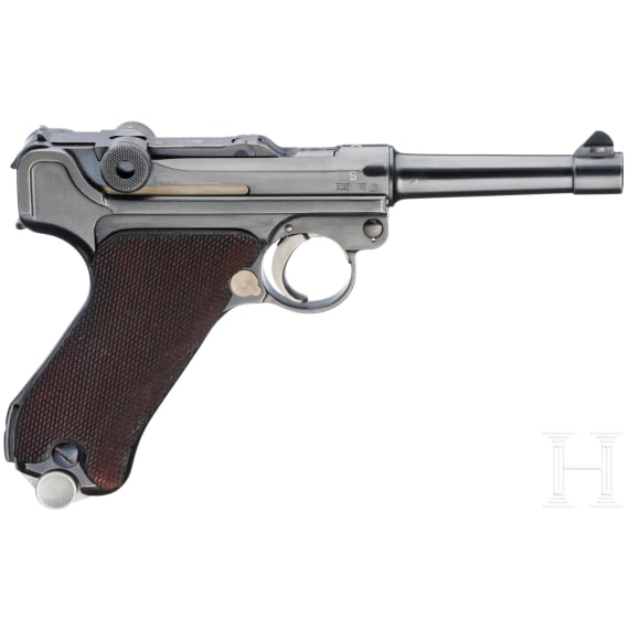 A Luger pistol by Mauser, code "K - S/42", with two matching-number mags and holster