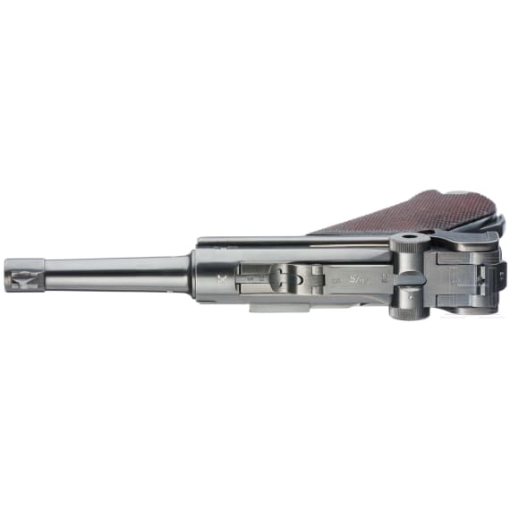 A Luger pistol by Mauser, code "K - S/42", with two matching-number mags and holster