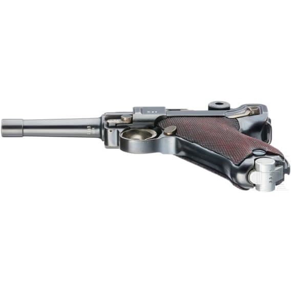 A Luger pistol by Mauser, code "K - S/42", with two matching-number mags and holster
