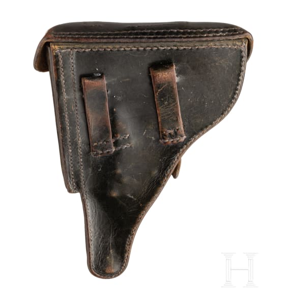 A Luger pistol by Mauser, code "K - S/42", with two matching-number mags and holster