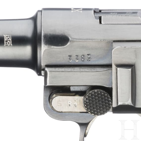 A Luger pistol by Mauser, code "K - S/42", with two matching-number mags and holster