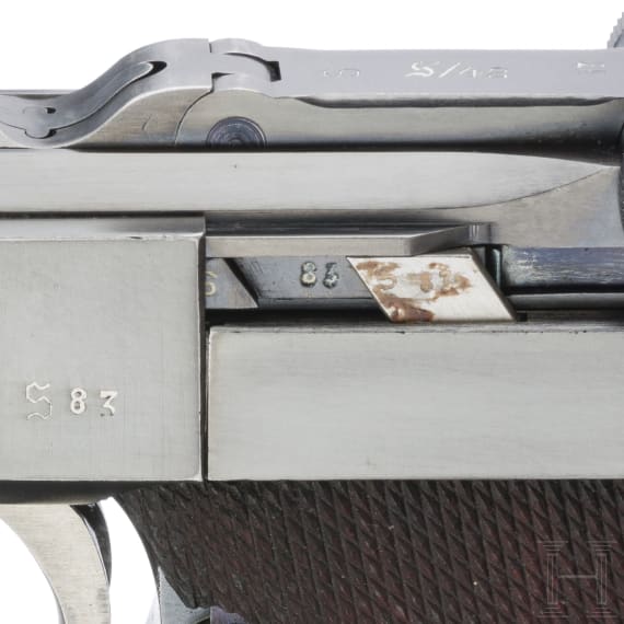 A Luger pistol by Mauser, code "K - S/42", with two matching-number mags and holster