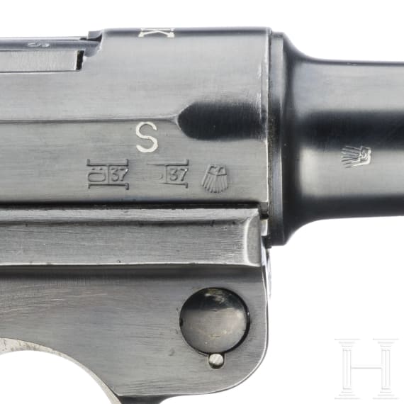 A Luger pistol by Mauser, code "K - S/42", with two matching-number mags and holster