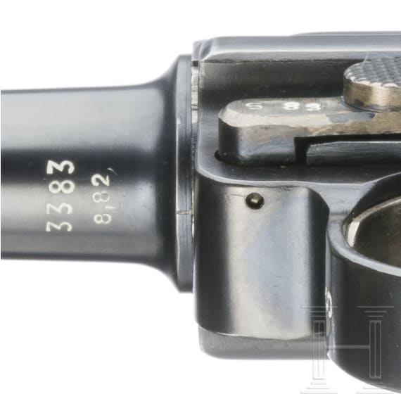 A Luger pistol by Mauser, code "K - S/42", with two matching-number mags and holster