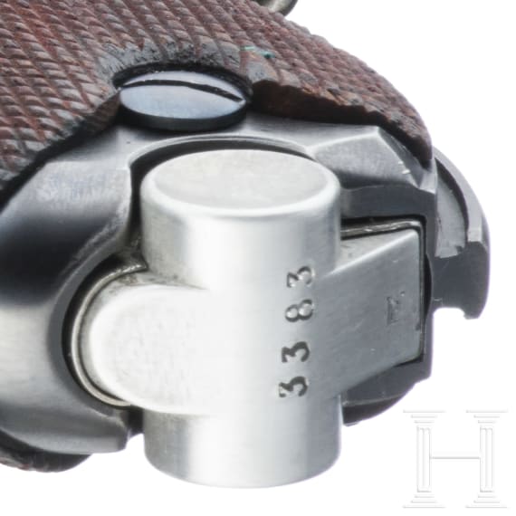 A Luger pistol by Mauser, code "K - S/42", with two matching-number mags and holster