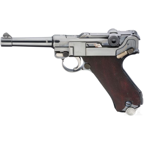 A Luger pistol by Mauser, code "K - S/42", with two matching-number mags and holster