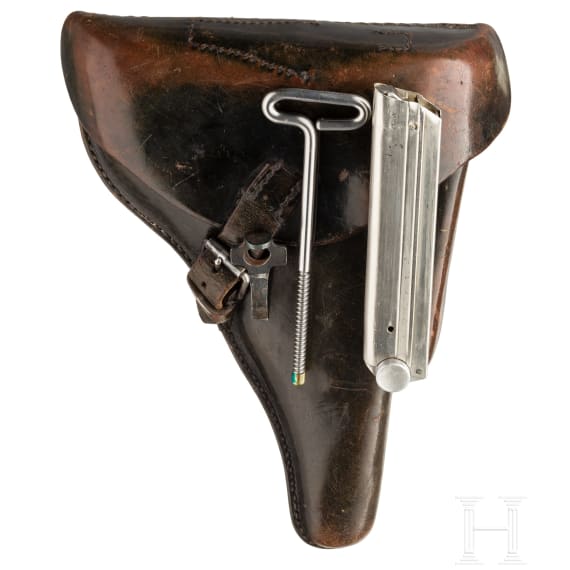 A Luger pistol by Mauser, code "K - S/42", with two matching-number mags and holster