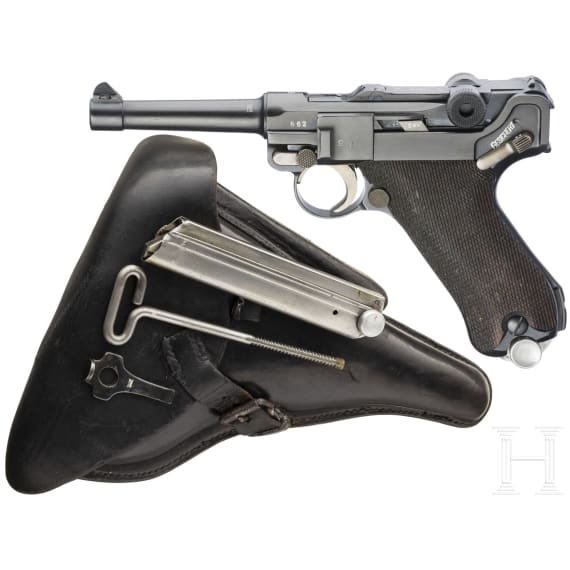 A Luger pistol by Mauser, code "K - S/42", with two matching-number mags and holster