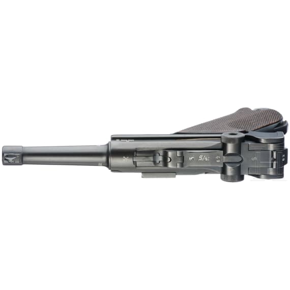 A Luger pistol by Mauser, code "K - S/42", with two matching-number mags and holster