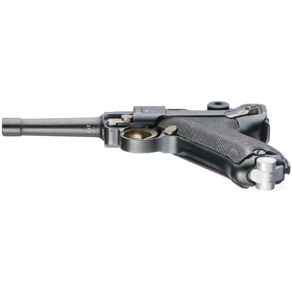 A Luger pistol by Mauser, code "K - S/42", with two matching-number mags and holster
