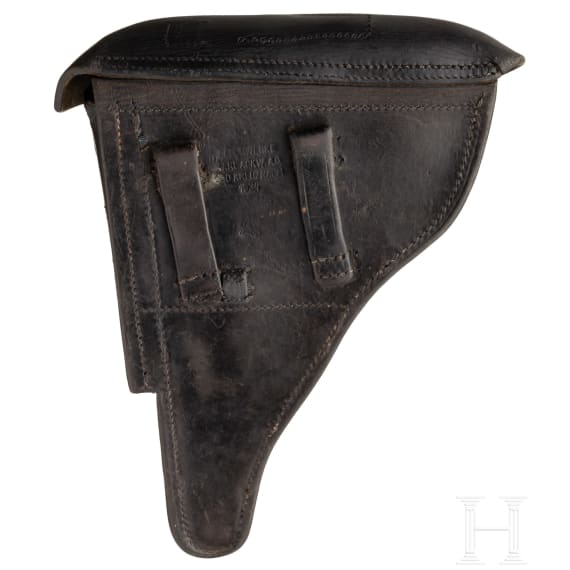 A Luger pistol by Mauser, code "K - S/42", with two matching-number mags and holster