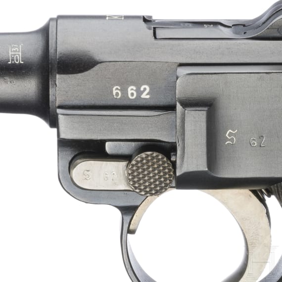 A Luger pistol by Mauser, code "K - S/42", with two matching-number mags and holster
