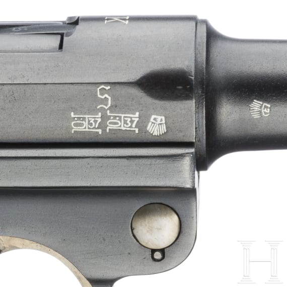 A Luger pistol by Mauser, code "K - S/42", with two matching-number mags and holster