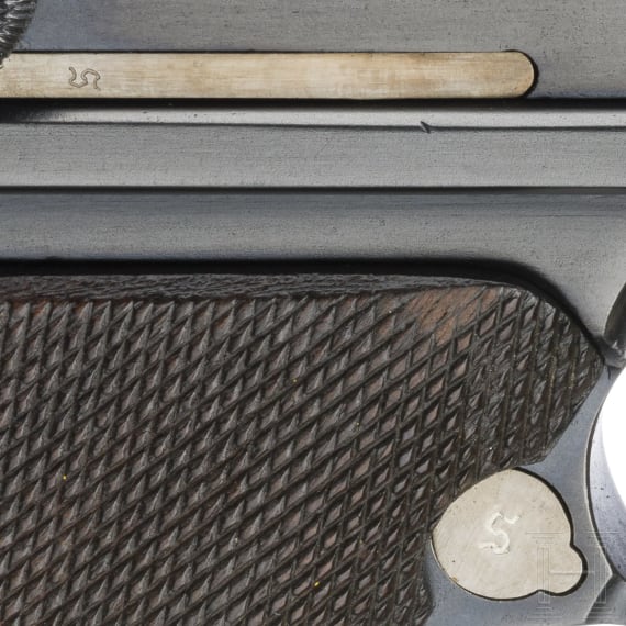 A Luger pistol by Mauser, code "K - S/42", with two matching-number mags and holster