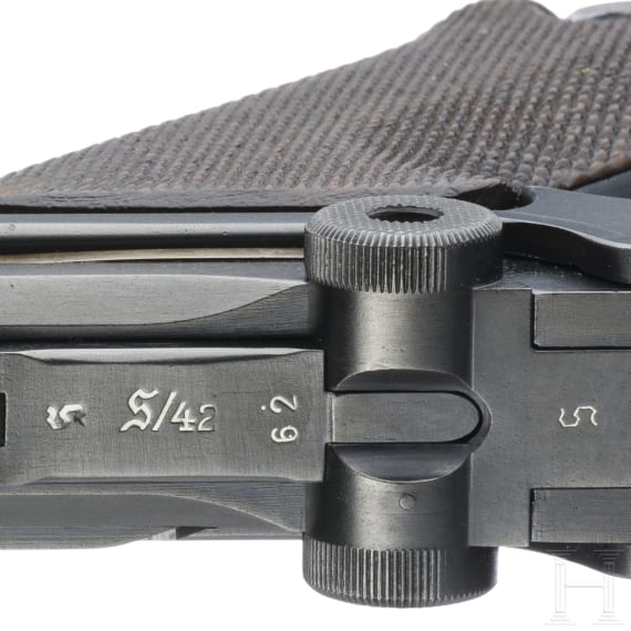 A Luger pistol by Mauser, code "K - S/42", with two matching-number mags and holster