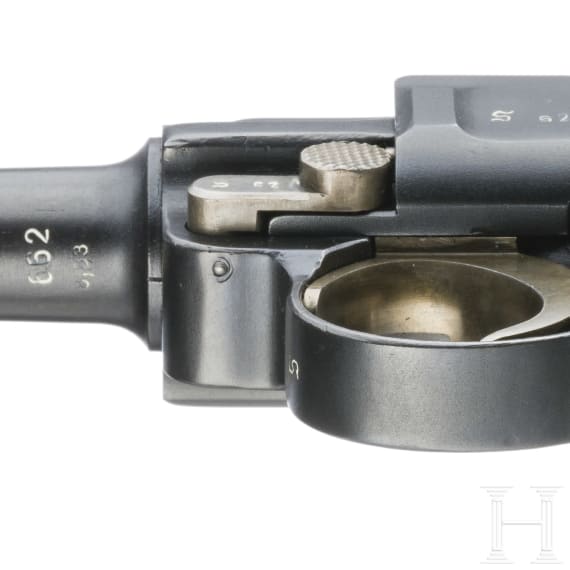 A Luger pistol by Mauser, code "K - S/42", with two matching-number mags and holster