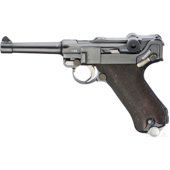 A Luger pistol by Mauser, code "K - S/42", with two matching-number mags and holster