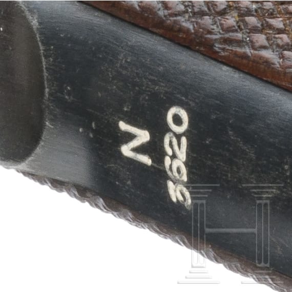 A Luger pistole by Mauser, code "1938 - S/42", 2 matching magazines, holster; Kriegsmarine