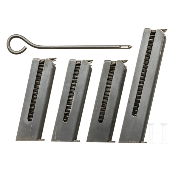 Four magazines for an FN Mod. 1903, cleaning rod
