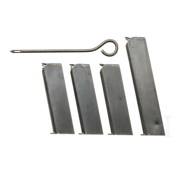 Four magazines for an FN Mod. 1903, cleaning rod