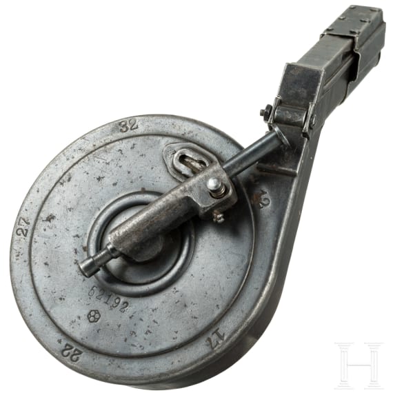 A snail drum magazine, first pattern, for a Luger pistol, by Bing in Nuremberg, with dust cover