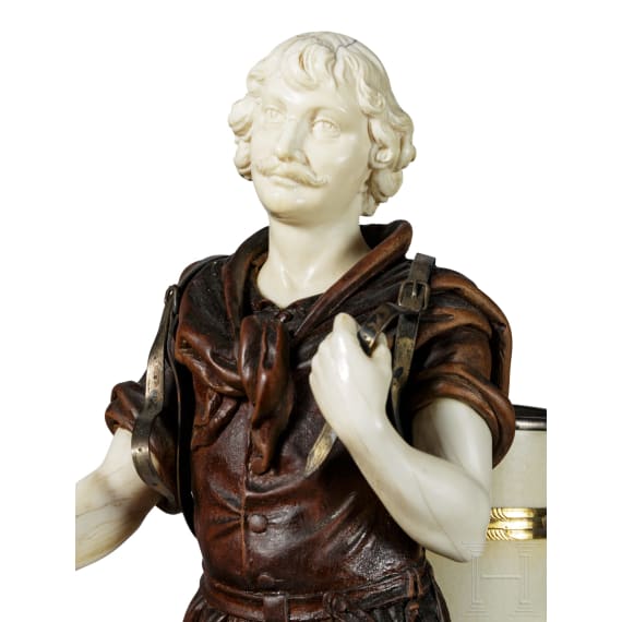 A silver-mounted ivory and boxwood figure of a winemaker in the manner of Simon Troger, late 19th century