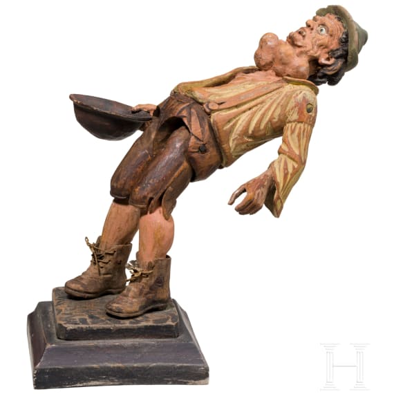 A German movable figurine of a beggar, circa 1800