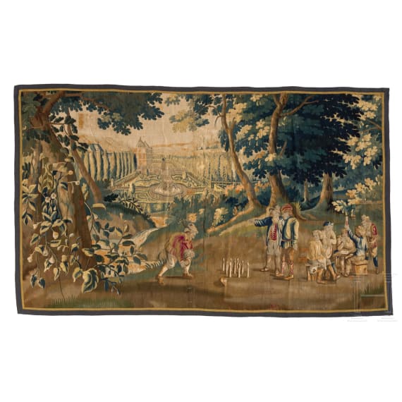 A large Flemish tapestry depicting a genre scene with bowling players, 17th century