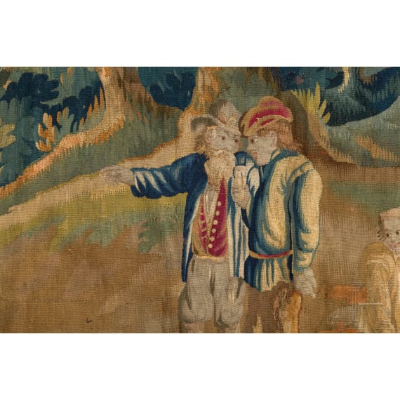 A large Flemish tapestry depicting a genre scene with bowling players, 17th century