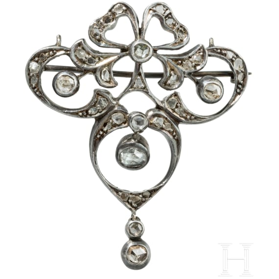 A gold-mounted art nouveau silver brooch set with diamonds
