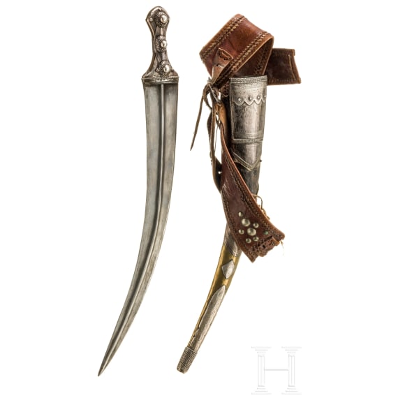 A Saudi Arabian silver-mounted Wahabite djambya with a sling, c. 1900