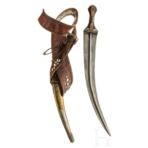A Saudi Arabian silver-mounted Wahabite djambya with a sling, c. 1900