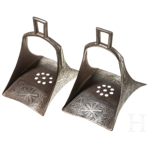 A pair of Persian silver damascened stirrups, 19th century