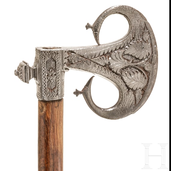 An Indian iron carved battle axe, 18th century