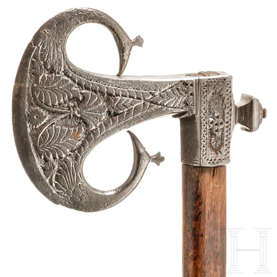 An Indian iron carved battle axe, 18th century